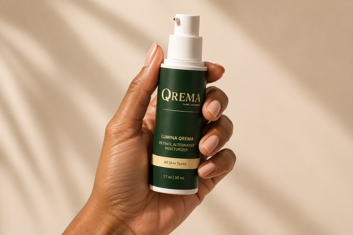 A hand holding a bottle of QREMA Lumina Orema Retinol Alternating Moisturizer against a warm beige background with soft leaf shadows.