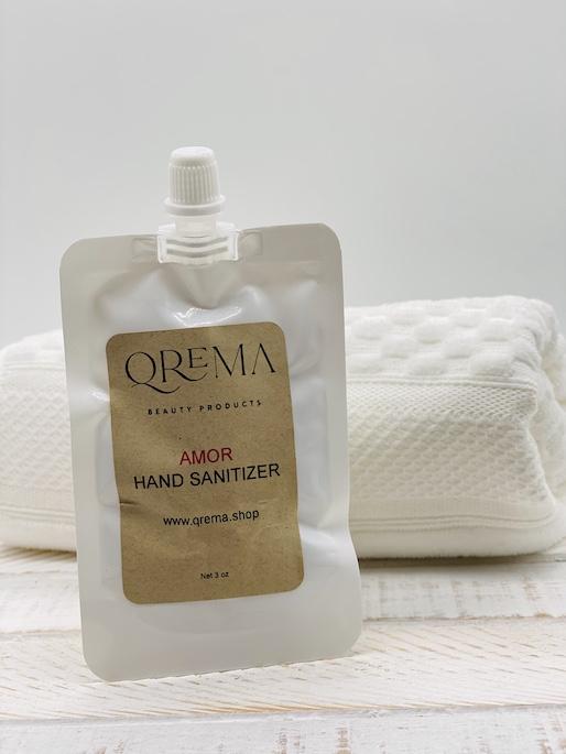 Qrema AMOR Hand Sanitizer. A romantic floral scent!  Ingredients: 91% isopropyl alcohol, aloe vera gel, fragrance essential oil.  *hand sanitizer contains 80% isopropyl alcohol*  AMOR has properties that are: anti-inflammatory. antiarthritic. antioxidant, antiviral, antispasmodic, antimicrobial, reduce anxiety, stress, depression, and pain and increase libido.  Shake well before use. Follow with your favorite Qrema Body Balm for best results.  Net 2 oz 