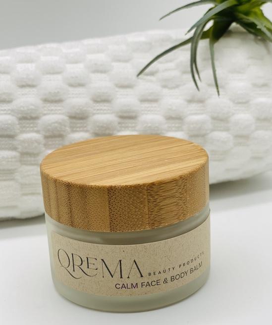 Qrema CALM Face & Body Balm - Qrema Enter a state of heavenly bliss with our Coconut Lavender scented face & body balm. Buttery Coconut softens rough skin and Lavender essence calm the mind and spirit.  Calm has properties that are soothing, relaxing, relieves pain. It can help ease muscles, joint pain, sprains and backache.  Ingredients: shea butter, mineral oils, fragrance essential oil and natural powder.  *Contains Tree Nuts 2 oz glass container with bamboo lid.